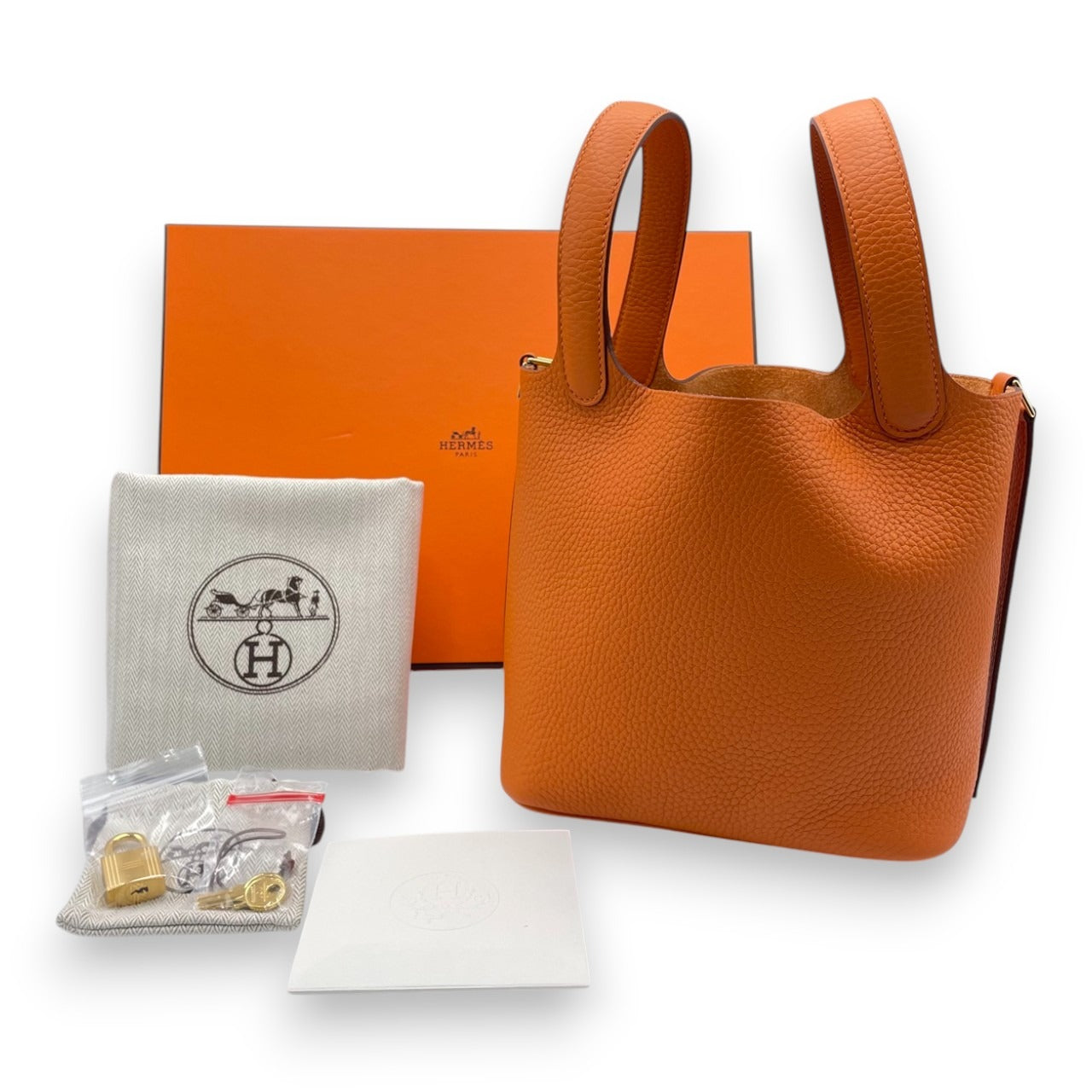 Pre-owned Hermes Picotan Lock PM Orange Taurillon Clemence Gold hardware K stamp