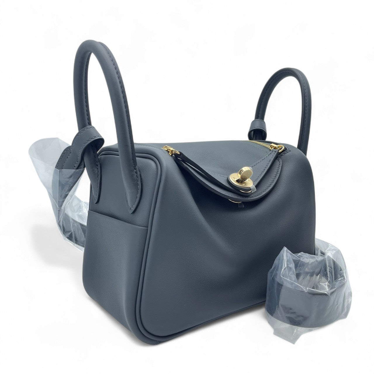 중고 에르메스 린디 미니 20 그리미스티/느와르 스위프트 샴페인 골드 하드웨어 K 스탬프